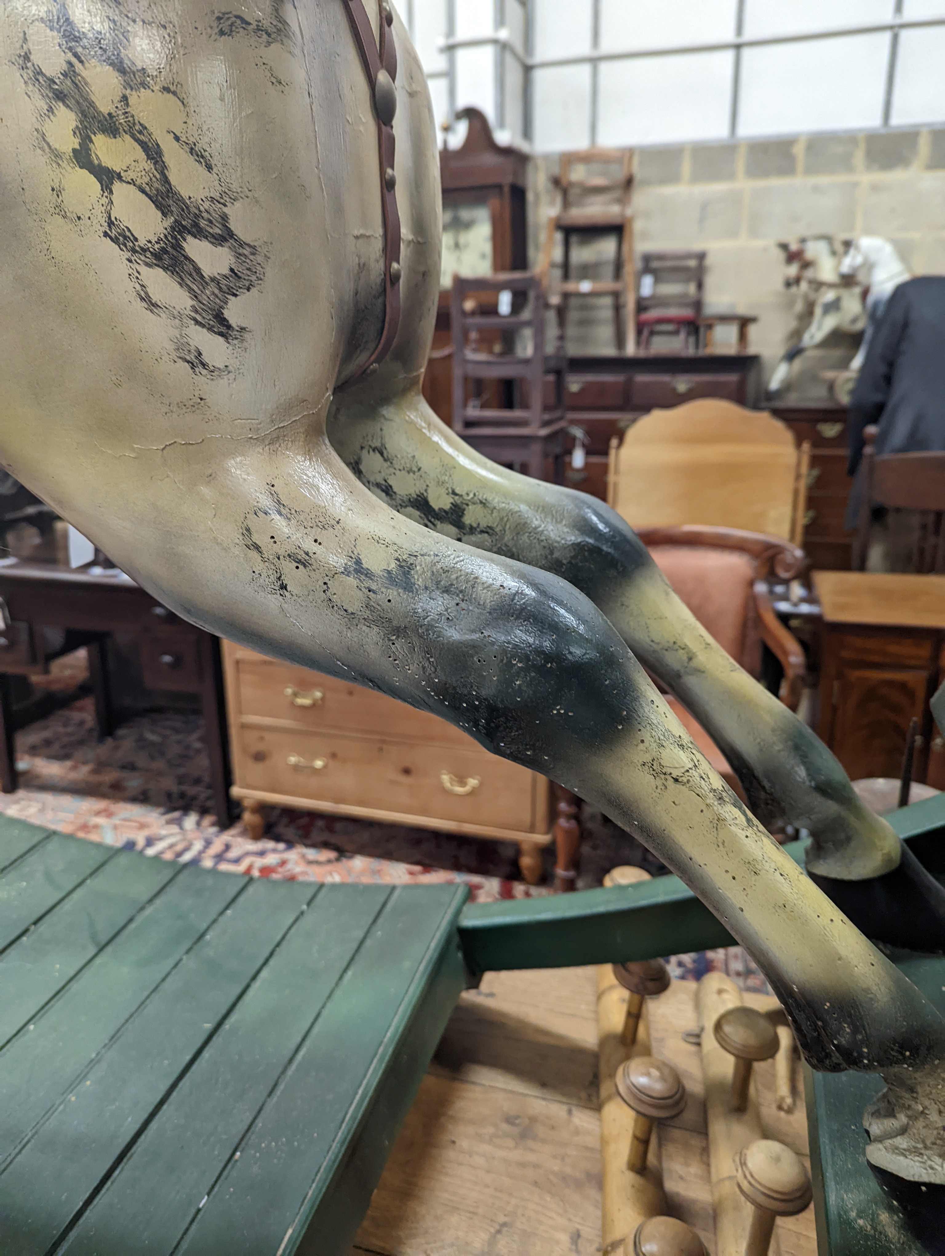 A large Victorian style painted rocking horse with end seats, length 240cm, height 132cm